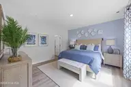 407 Loggerhead Boulevard, Surf City, NC 28445 — 3-bedroom home in Turtle Creek, Surf City, NC, photo 10 of 19: Pebble Primary Bedroom 3
