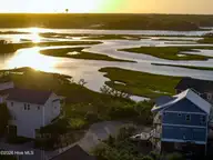 0 W Wilmington Avenue, Surf City, NC 28445 — 5-bedroom waterfront home in Topsail Cove, Surf City, NC, photo 11 of 17: Sunset view