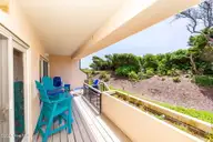 331 Salter Path Road 104 Beachwalk, Pine Knoll Shores, NC 28512 — 3-bedroom waterfront condo in Beachwalk, Pine Knoll Shores, NC, photo 9 of 47: Covered deck w/ ocean views