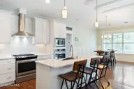 6313 Chadmore Lane SW, Ocean Isle Beach, NC 28469 — 4-bedroom home in Retreat At OIB, Ocean Isle Beach, NC, photo 14 of 49: Double convection ovens/gas cooktop