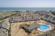 9201 Coast Guard Road I-207, Emerald Isle, NC 28594 — 1-bedroom waterfront condo in Pebble Beach, Emerald Isle, NC, photo 18 of 25: Coastal condominium with pool view