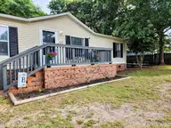 623 Sandy Bluff Drive SW, Supply, NC 28462 — 3-bedroom manufactured home in Sandy Bluff, Supply, NC, photo 18 of 26: Mature Landscaping