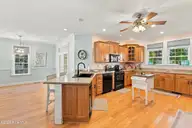 1031 Mallard Bay Road, Hampstead, NC 28443 — 4-bedroom waterfront home in Mallard Bay, Hampstead, NC, photo 19 of 72: 29_dining kitchen