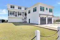 8703 Ocean View Drive East, Emerald Isle, NC 28594 — 5-bedroom waterfront townhome, Emerald Isle, NC, photo 2 of 62: East Roadside Exterior