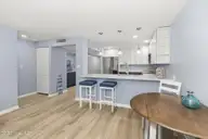 331 Salter Path Road 104 Beachwalk, Pine Knoll Shores, NC 28512 — 3-bedroom waterfront condo in Beachwalk, Pine Knoll Shores, NC, photo 15 of 47: Updated kitchen w/ bar seating