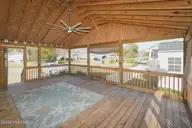 802 E Oak Island Drive, Oak Island, NC 28465 — 3-bedroom home in Long Beach, Oak Island, NC, photo 8 of 27: Screenedin Porch-026-011-1500x1000