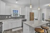 7177 Old Stump Drive SE, Leland, NC 28451 — 4-bedroom home in Cypress Bay, Leland, NC, photo 19 of 70: Spacious Kitchen
