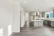 52 Pier View Court, Hampstead, NC 28443 — 4-bedroom waterfront home, Hampstead, NC, photo 14 of 60: 23_hallway & kitchen