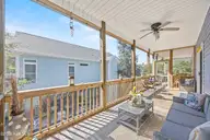 128 NE 8th Street, Oak Island, NC 28465 — 3-bedroom home, Oak Island, NC, photo 17 of 55: 39_screened porch