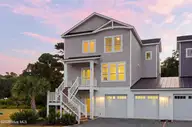 52 Pier View Court, Hampstead, NC 28443 — 4-bedroom waterfront home, Hampstead, NC, photo 7 of 60: 5_front right exterior sunset