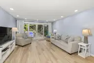 331 Salter Path Road 104 Beachwalk, Pine Knoll Shores, NC 28512 — 3-bedroom waterfront condo in Beachwalk, Pine Knoll Shores, NC, photo 2 of 47: Open living room