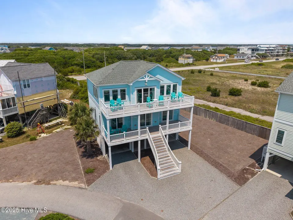 132 N Permuda Wynd Drive, North Topsail Beach, NC 28460 — 4-bedroom waterfront home in Village of Stump Sound, North Topsail Beach, NC, photo 1 of 65: 6-web-or-mls-DJI_20250508131717_0228_D
