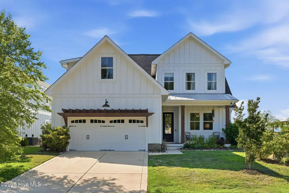 331 Spicer Lake Drive, Holly Ridge, NC 28445 — 4-bedroom waterfront home in Summerhouse On Everett Bay, Holly Ridge, NC, photo 1 of 76